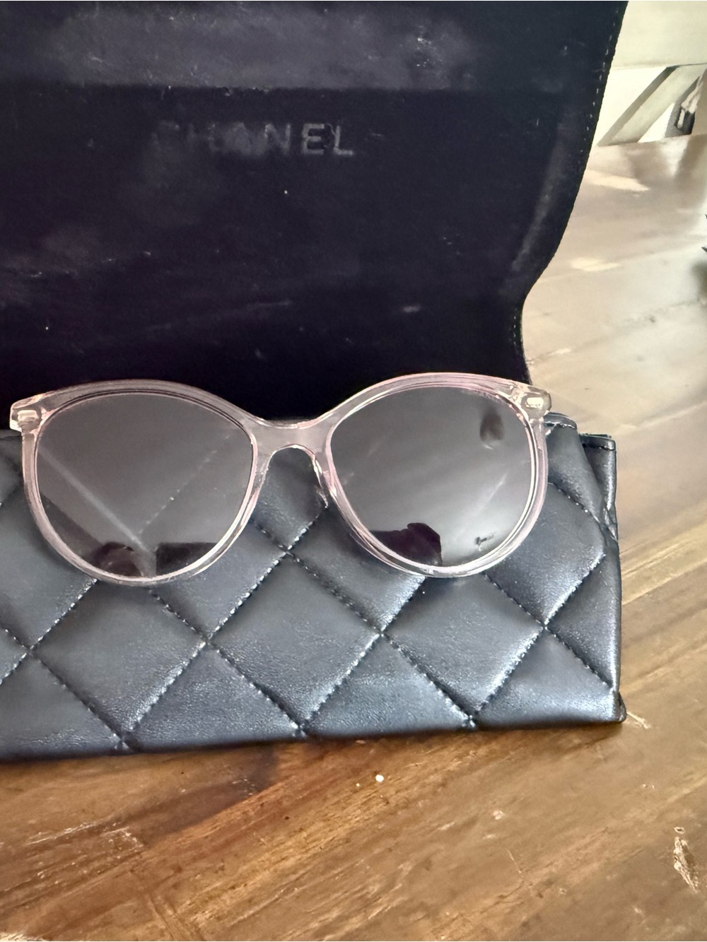 CHANEL Transparent Light Pink Round Sunglasses with Dark Lenses